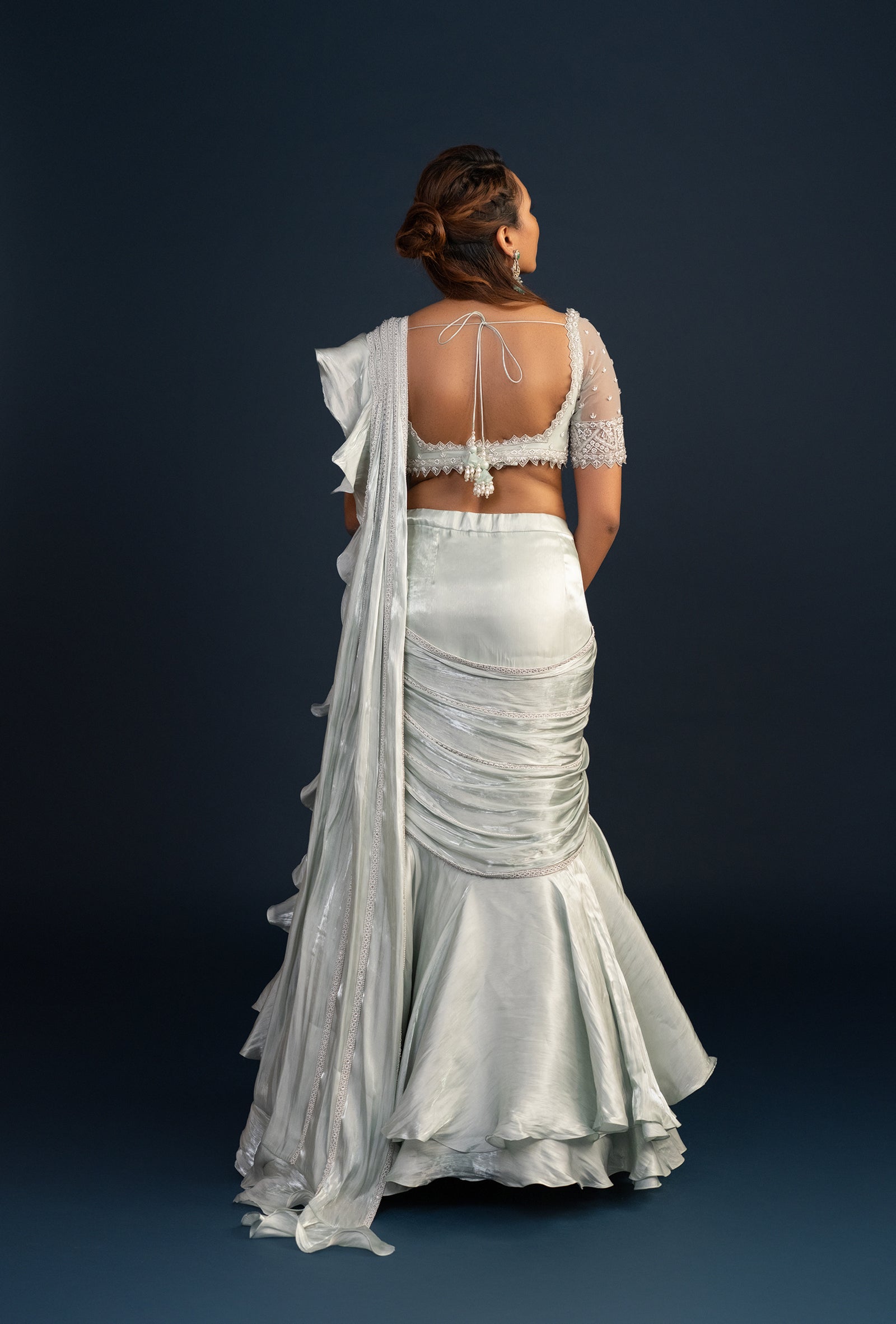 Demure Milky Green with Ruffled Gabana Silk draped dupatta Lehenga Set