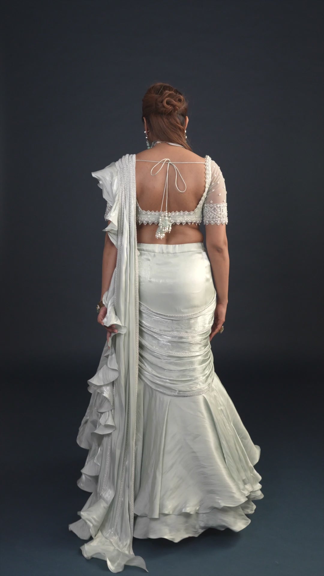 Demure Milky Green with Ruffled Gabana Silk draped dupatta Lehenga Set