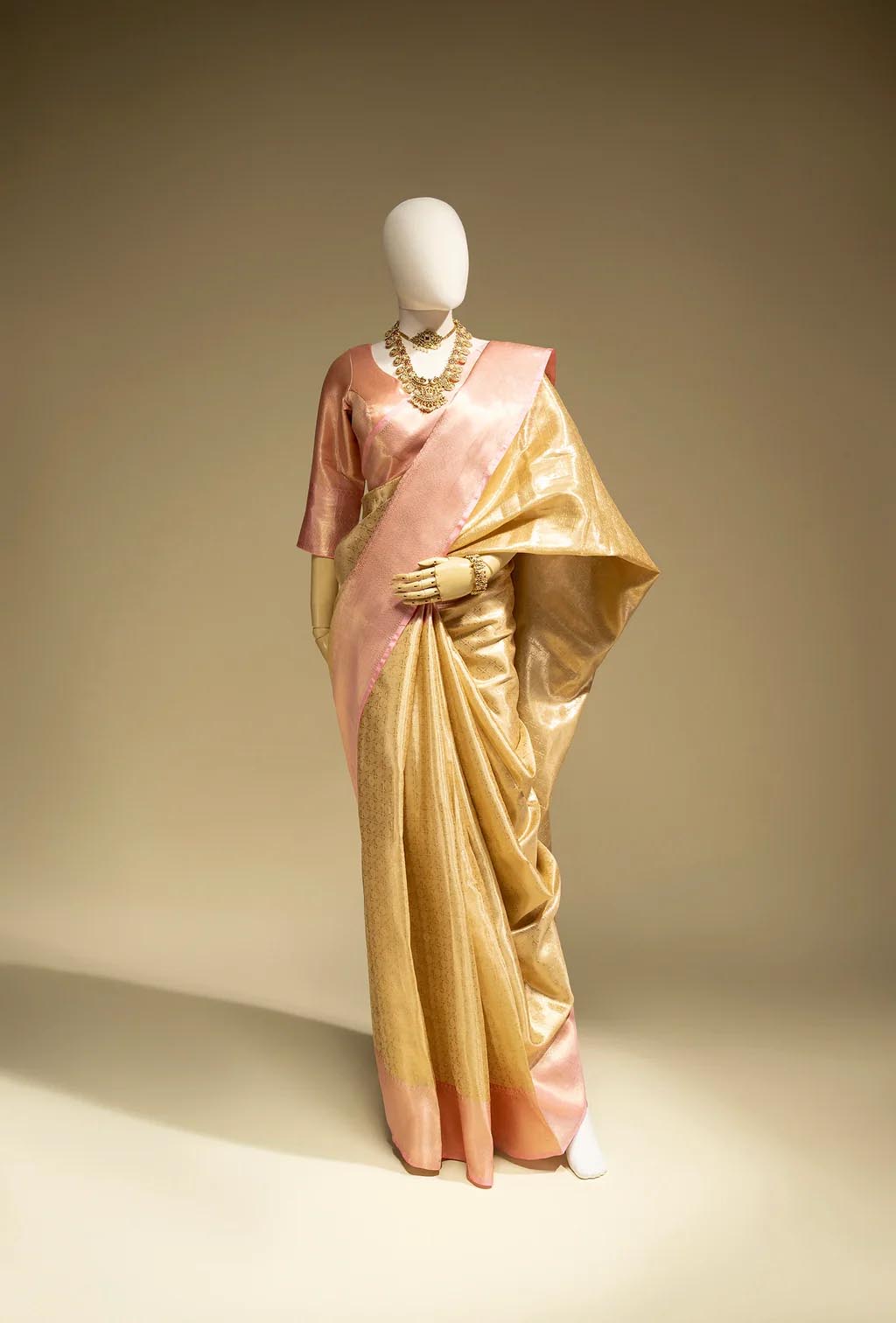 Tissue Silk Saree In Golden And Pink With Paisley Motifs