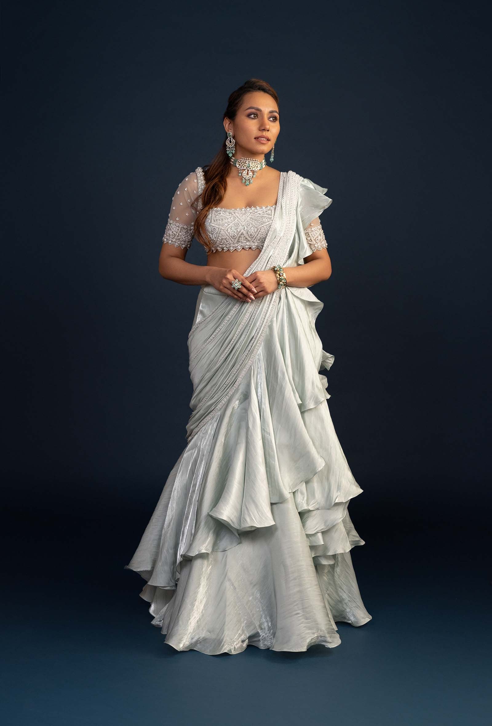 Demure Milky Green with Ruffled Gabana Silk draped dupatta Lehenga Set