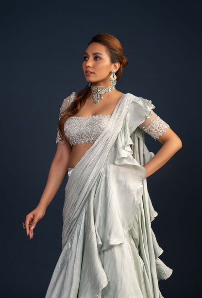 Demure Milky Green with Ruffled Gabana Silk draped dupatta Lehenga Set