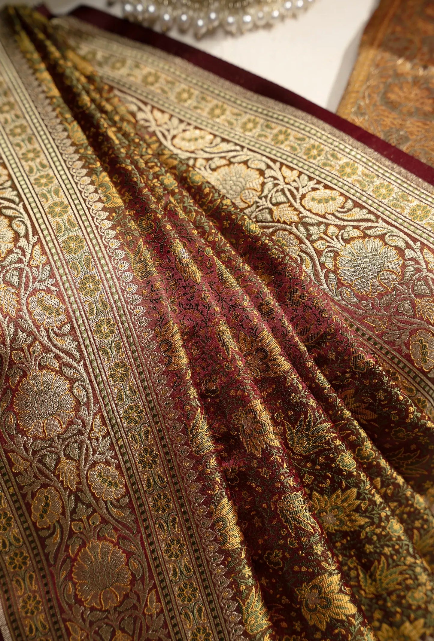 Patola Saree In Wine Brown With Exquisite Floral Work